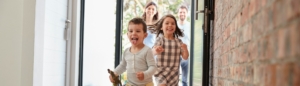 Happy family entering new home