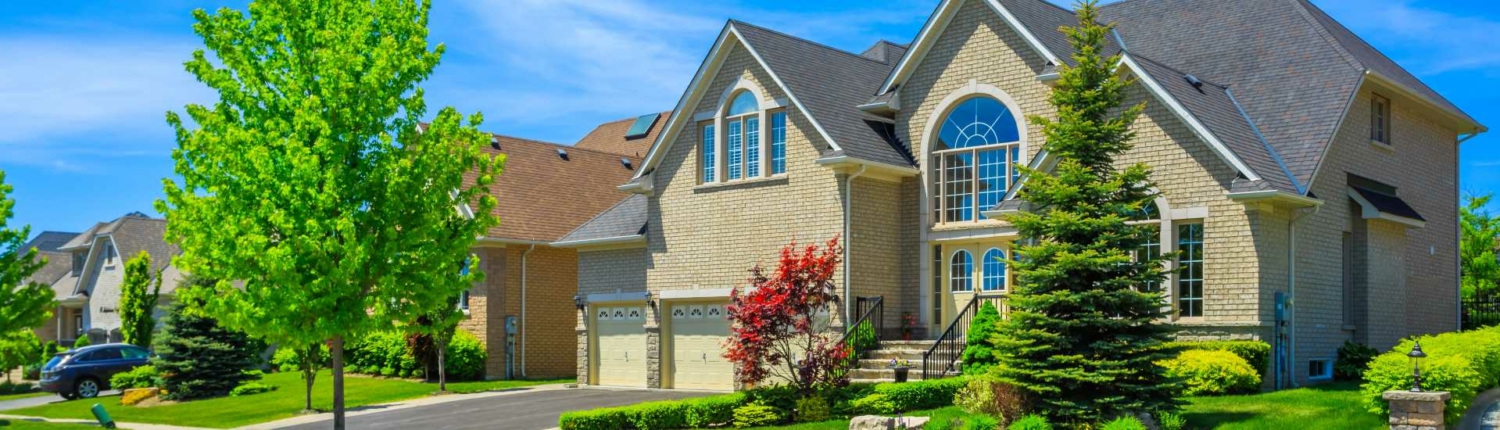 Large brick house with nice landscaping